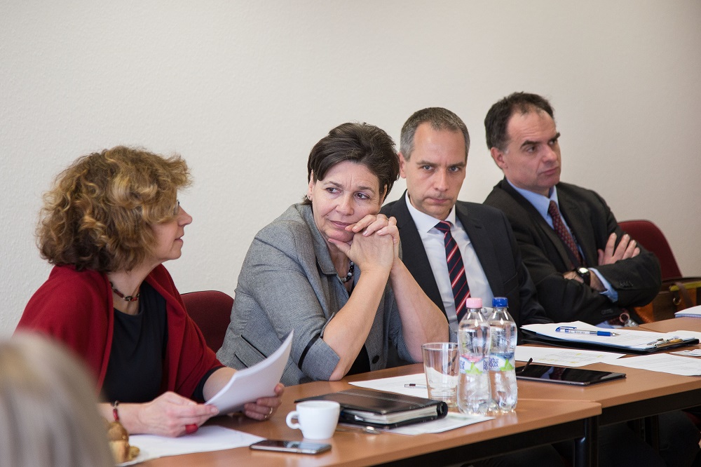 Pölöskeiné listening to PTF Lead Andrea Juhos
